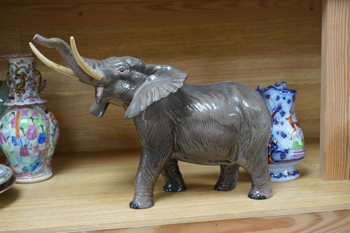 A Beswick model of an elephant and a Staffordshire jug, c.1840, largest 34cm wide